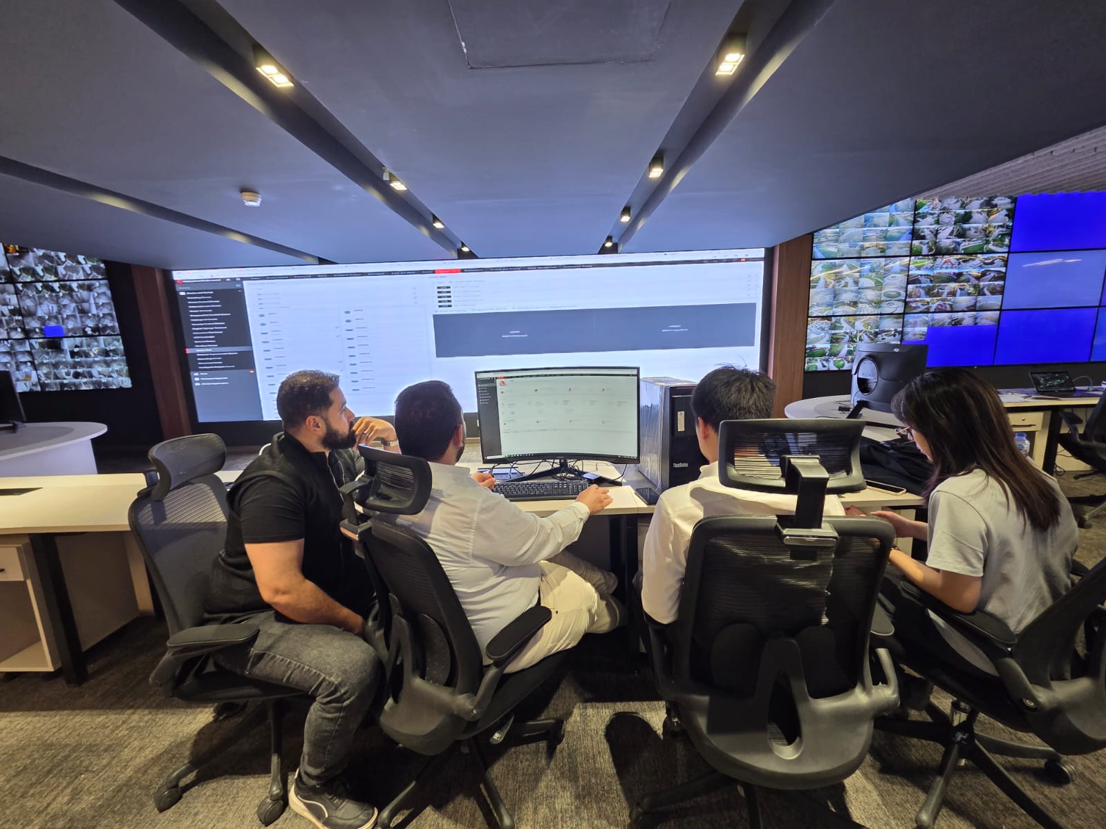 Operations team working at SOC consoles